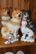 A GROUP OF 19TH AND EARLY 20TH CENTURY CERAMIC CATS AND DOGS, comprising a late 19th century