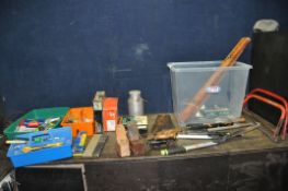 A PLASTIC BOX AND TWO TRAYS CONTAINING TOOLS including two vintage saws, two spirit levels, two