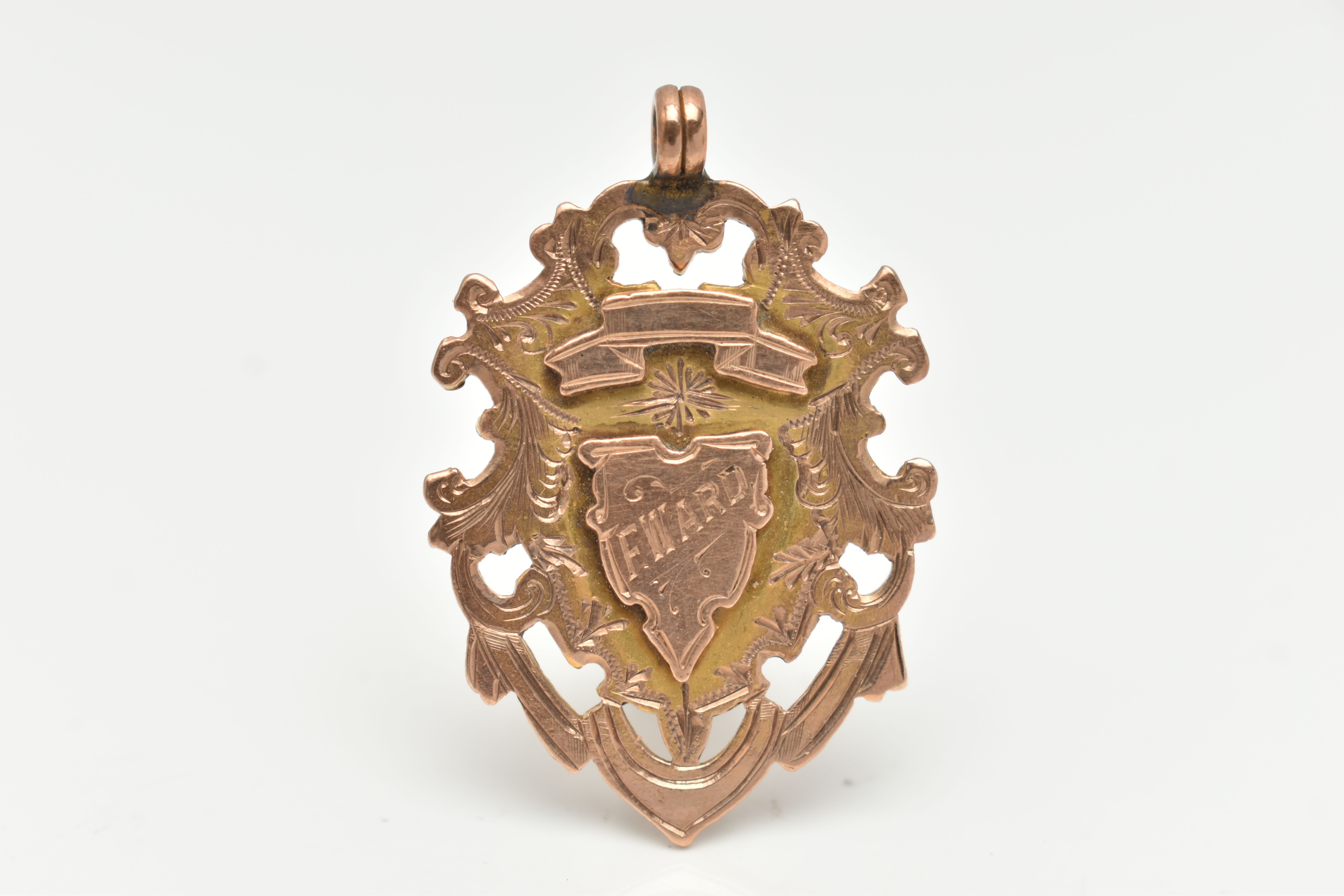 A LATE VICTORIAN 9CT GOLD FOB MEDAL, shield shape with engraved monogram, engraved to the reverse '