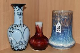 A GROUP OF THREE COBRIDGE STONEWARE VASES, comprising a mottled blue, white and purple vase,
