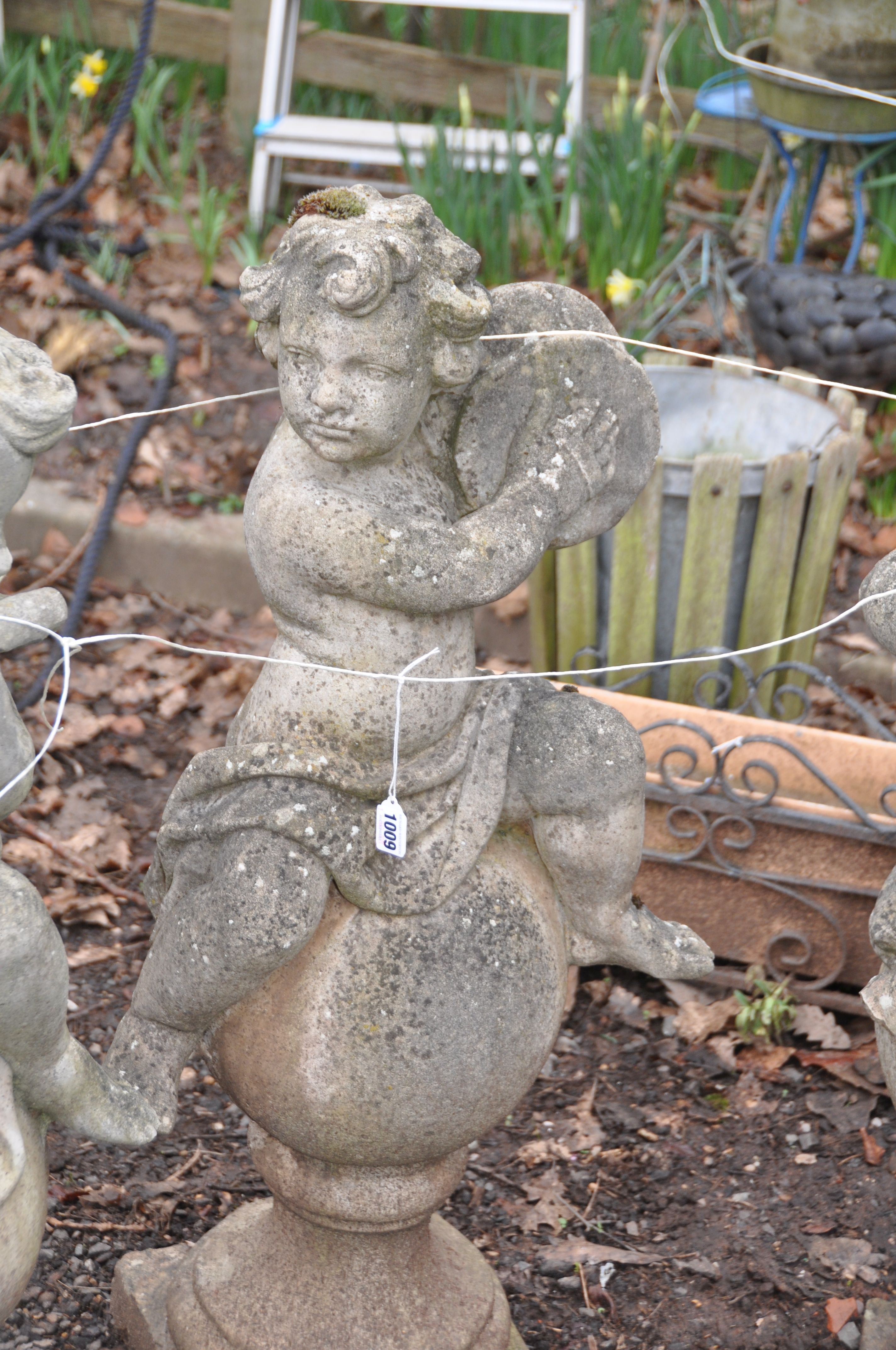 A SET OF THREE MOULDED GARDEN FIGURES IN THE FORM OF CHILDREN EACH PLAYING A MUSICAL INSTRUMENT - Image 3 of 4