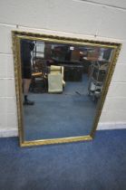 A RECTANGULAR GILT FRAMED BEVELLED EDGE WALL MIRROR, 99cm x 129cm (condition report: overall good