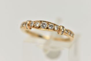 AN 18CT GOLD, DIAMOND HALF ETERNITY RING, set with seventeen round brilliant cut diamonds, estimated