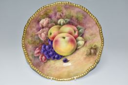 A COALPORT HAND PAINTED CABINET PLATE, with gilt rim, hand painted with apples, grapes and hazel