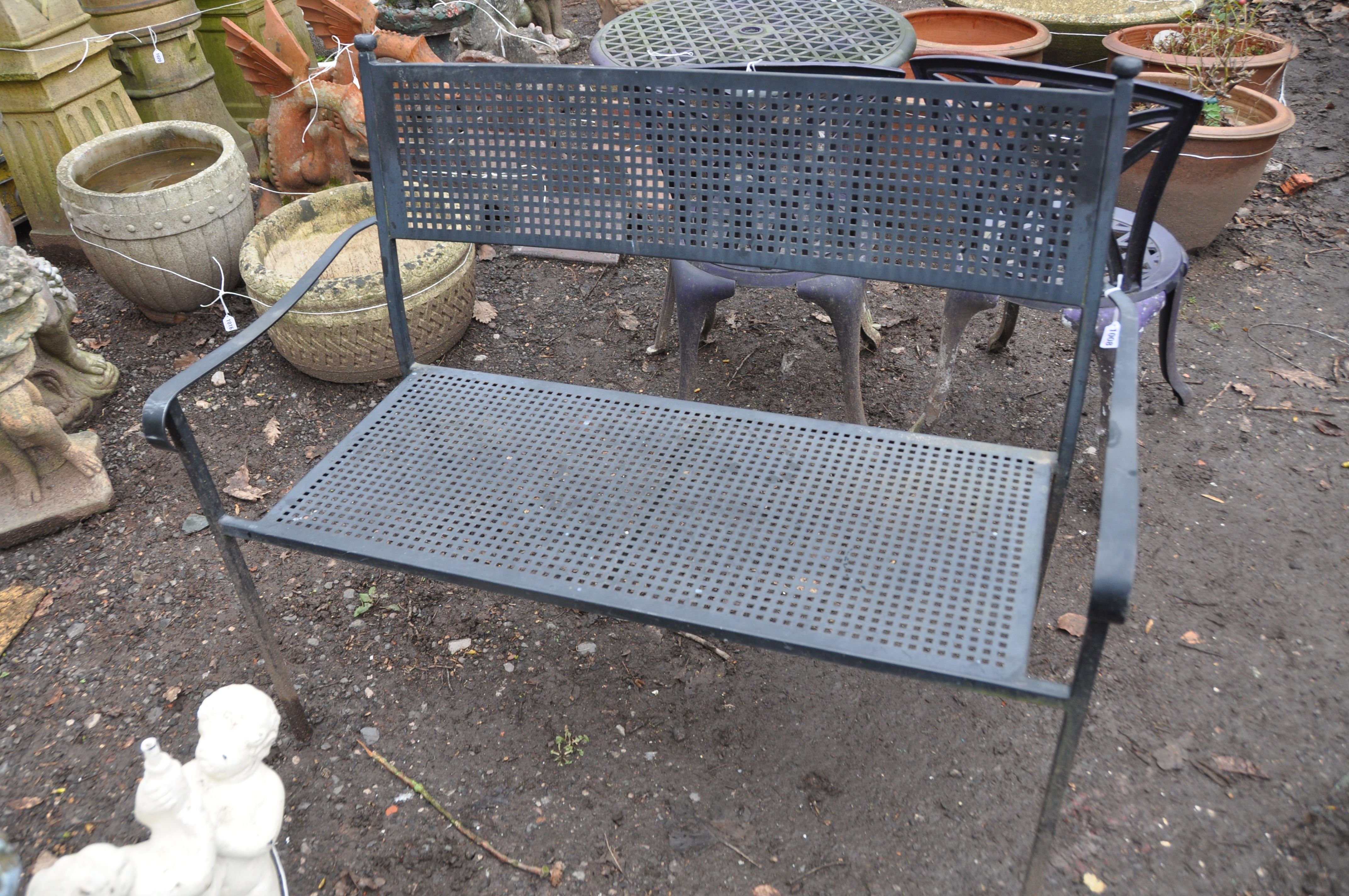A MODERN PAINTED METAL BENCH with geometric pierced shape to seat and back width 116cm