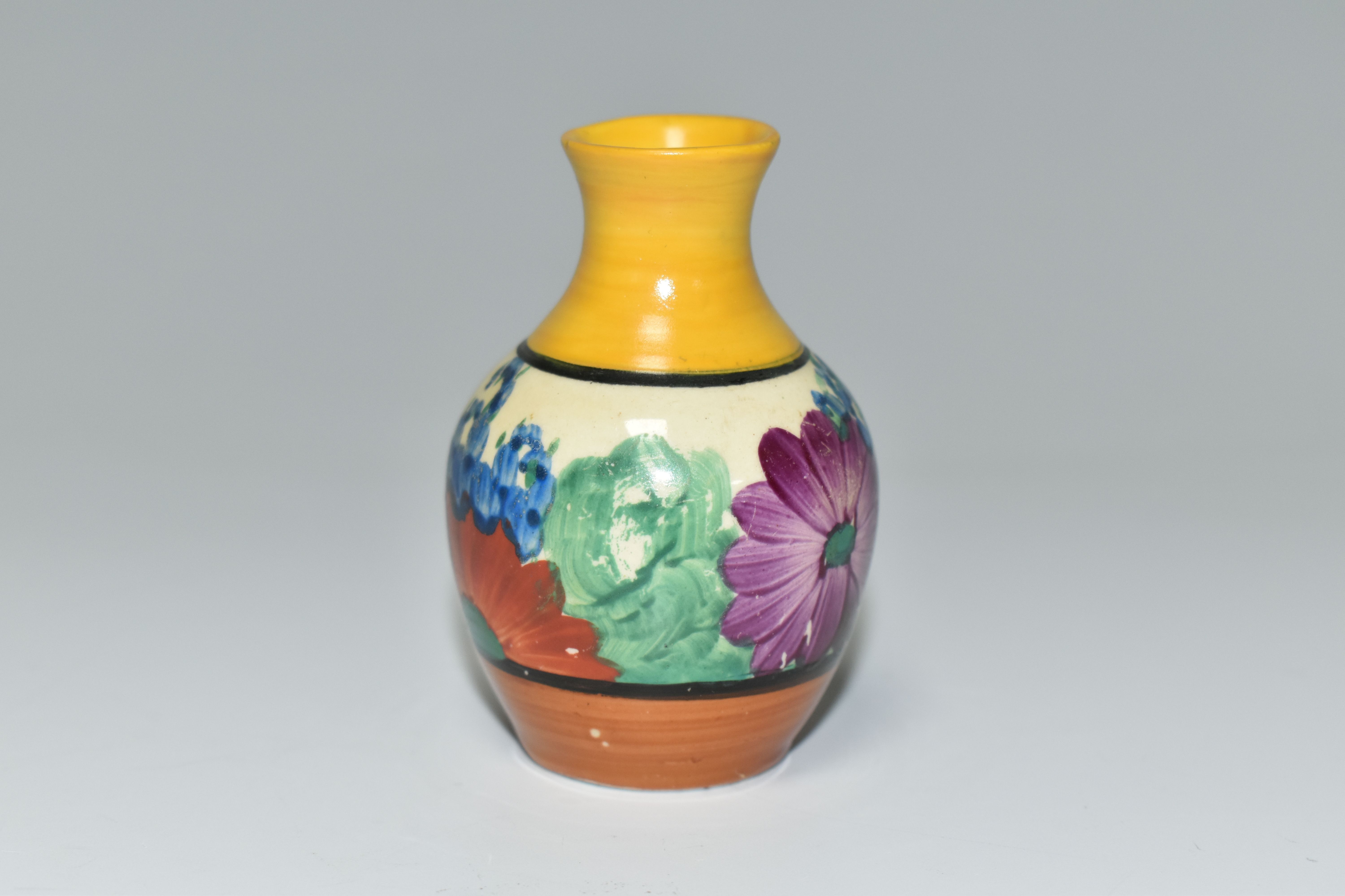 A CLARICE CLIFF MINIATURE VASE, in Gayday pattern, painted with orange, red, blue and purple - Image 3 of 5