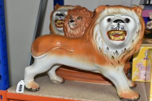 TWO PAIRS OF STAFFORDSHIRE LIONS, comprising one pair of standing lions, one has a reglued glass
