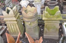 THREE MID 20th CENTURY CHIMNEY POTS two square in section 78and 72cm in height and one with a