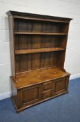 A GOOD QUALITY REPRODUCTION ELM DRESSER, the top two tier bookcase, atop a base that's fitted with