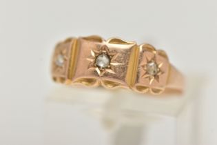 A LATE VICTORIAN GOLD DIAMOND RING, designed as three rose cut diamonds in star settings to the