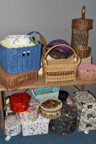 A QUANTITY OF WICKER BASKETS AND FLORAL STORAGE BOXES, com prising wicker picnic hampers, shopping