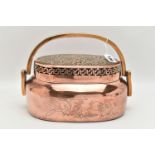 AN ORIENTAL COPPER AND BRASS HAND WARMER, engraved design to one side, pierced cover and fitted with