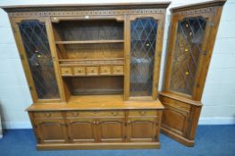 A 20TH CENTURY OAK JAYCEE DRESSER, the top with double lead glazed doors, that are enclosing glass