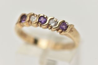 A 9CT GOLD AMETHYST AND DIAMOND RING, the five stone ring set with two brilliant cut diamonds and