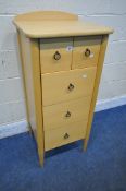 A SLIM BEECH CHEST OF FIVE DRAWERS, with a raised back and tapered legs, width 48cm x depth 45cm x