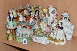 A GROUP OF NINE OF STAFFORDSHIRE POTTERY FIGURES, comprising a sheep, courting couples, two spill
