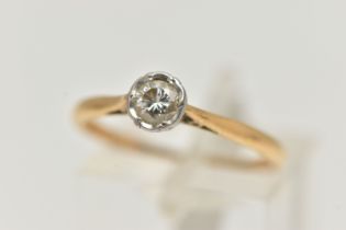 AN 18CT GOLD SINGLE STONE DIAMOND RING, the brilliant cut diamond within an illusion setting,