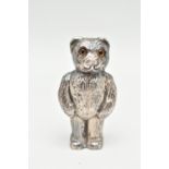 A SILVER NOVELTY VESTA CASE, in the form of a textured teddy bear with glass eyes, the head is a