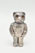 A SILVER NOVELTY VESTA CASE, in the form of a textured teddy bear with glass eyes, the head is a