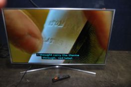 A SAMSUNG UE40MU6400 40in TV with remote (PAT pass and working)