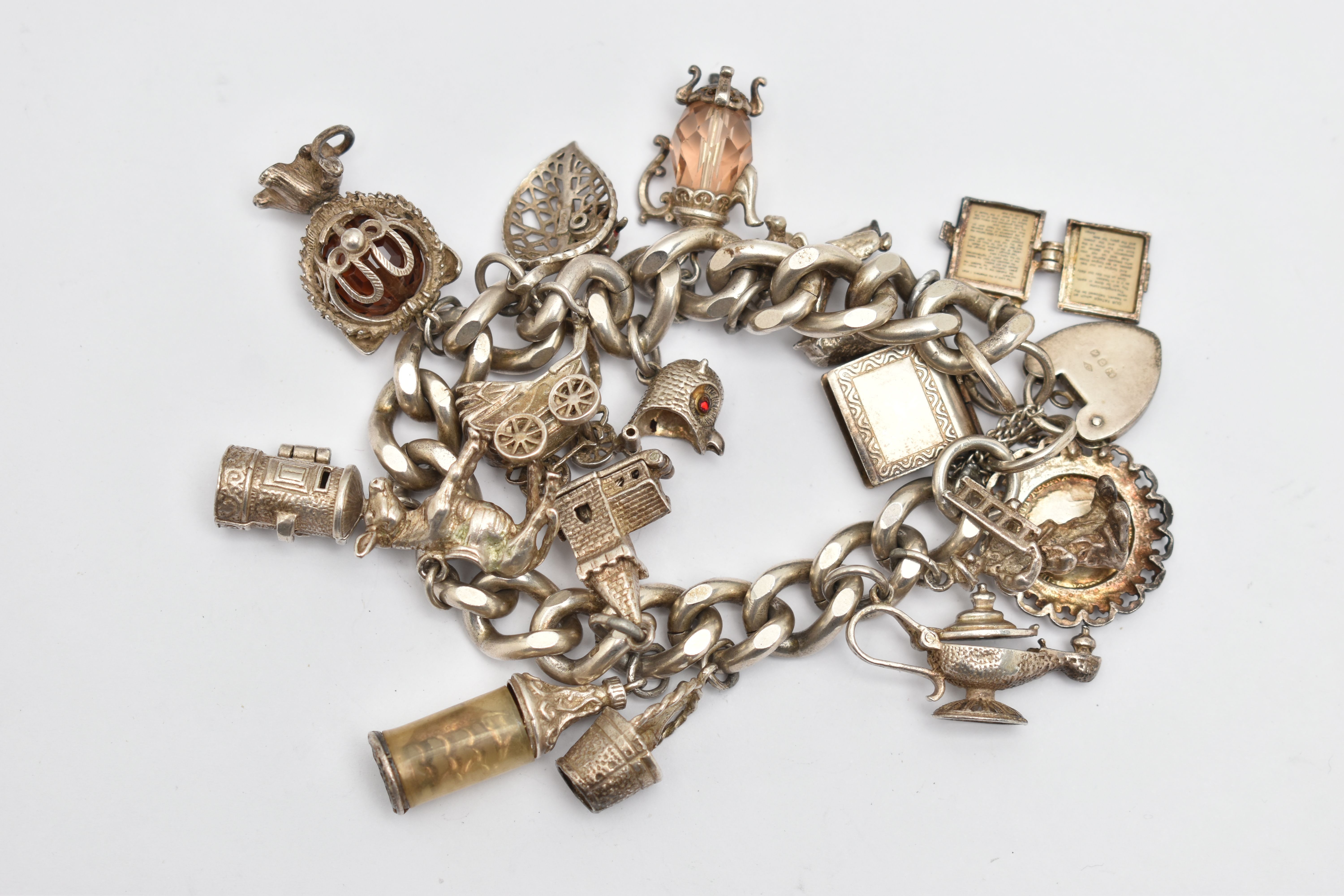 A SILVER CHARM BRACELET, a heavy curb link bracelet fitted with a heart padlock clasp, hallmarked ' - Image 2 of 2