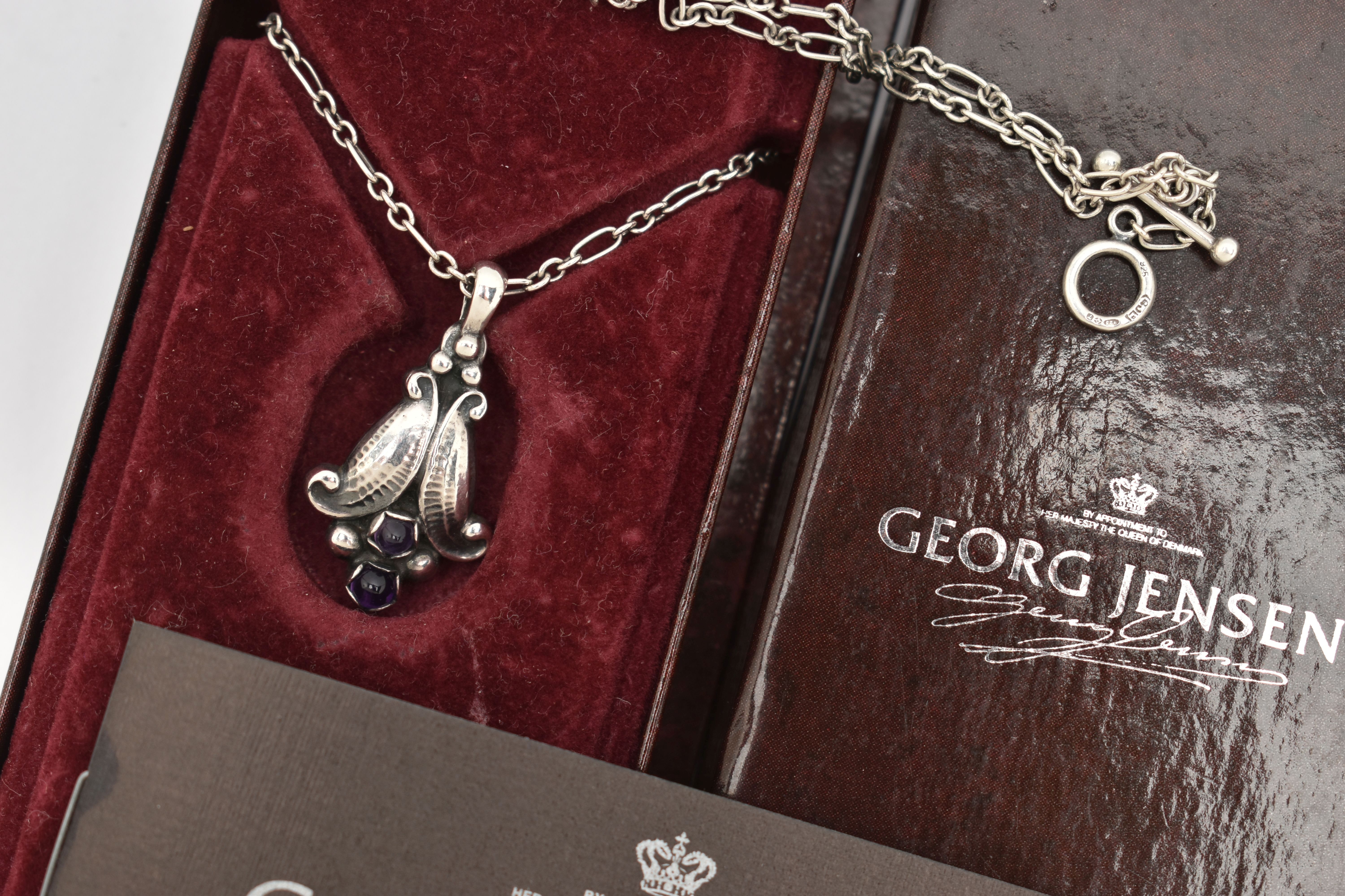 A BOXED 'GEORG JENSEN' PENDANT NECKLACE, floral drop pendant set with two amethyst dome cabochons, - Image 2 of 5