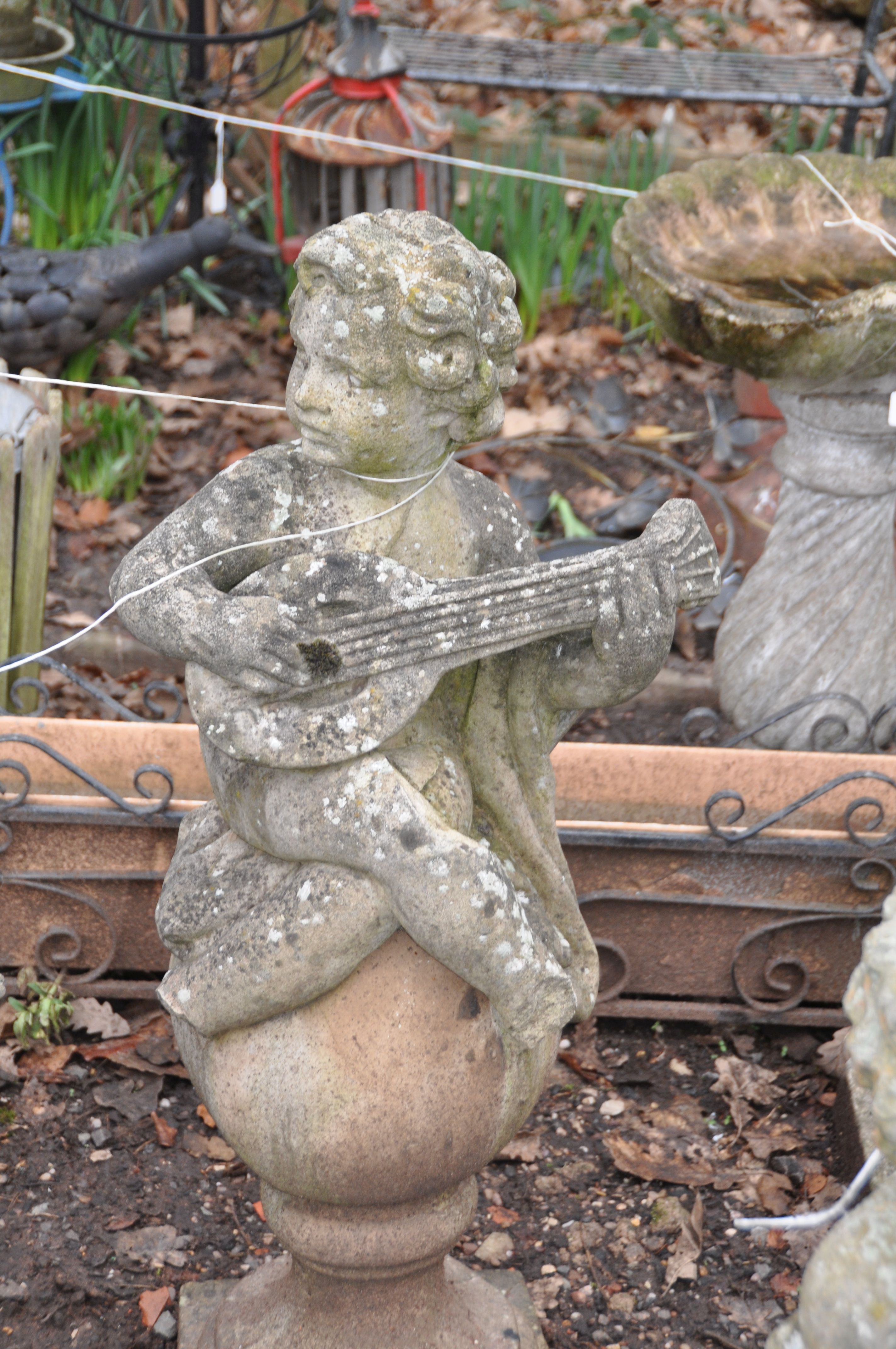 A SET OF THREE MOULDED GARDEN FIGURES IN THE FORM OF CHILDREN EACH PLAYING A MUSICAL INSTRUMENT - Image 4 of 4