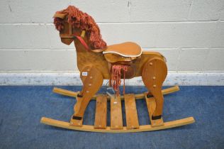 A PINE FRAMED ROCKING HORSE (condition report: tail loose, surface marks, scuffs, other signs of