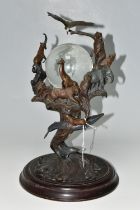 A BRONZE FRANKLIN MINT SCULPTURE 'GUARDIANS OF THE WORLD' CRYSTAL BALL, by Steven Lord, a central