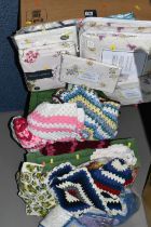 FOUR BOXES OF VINTAGE BED THROWS AND TABLE LINEN, to include a large quantity of handmade crochet