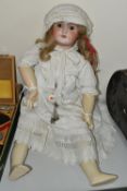 A LARGE TETE JUMEAU UNIS BISQUE HEAD DOLL, stamped 'Tete Jumeau' to nape of neck, mould no. 301,