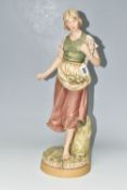 A ROYAL DUX FIGURE, comprising a young woman gathering seaweed, with applied pink triangular Royal