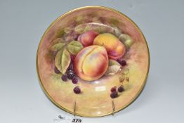 A COALPORT FOOTED HAND PAINTED FRUIT BOWL, signed R Budd (Richard Budd), decorated with plums and