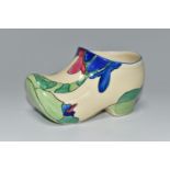 A CLARICE CLIFF SMALL SABOT/CLOG, in Rudyard pattern, painted with green, pink and blue stylised