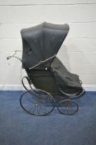 A LATE 19TH/EARLY 20TH CENTURY FORWARD FACING CHAIR PRAM, with folding canopy, buttoned back and