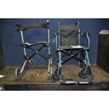 A DRIVE MEDICAL TRAVELITE LIGHTWEIGHT FOLDING WHEELCHAIR with two footrests and a Drive Medical