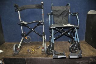 A DRIVE MEDICAL TRAVELITE LIGHTWEIGHT FOLDING WHEELCHAIR with two footrests and a Drive Medical