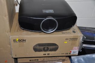 AN EPSON EH-TW9300 HOME CINEMA PROJECTOR in original packaging with remote and power cable along