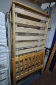 A MODERN PINE SINGLE BEDSTEAD, with pull out guest bed (condition report: with bolts)