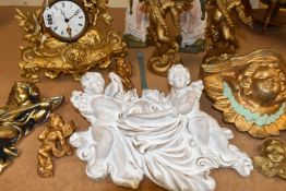 A LATE 19TH CENTURY GILT METAL MANTEL CLOCK AND A QUANTITY OF MODERN PLASTER CHERUB WALL PLAQUES,