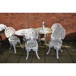 TWO CAST ALUMINIUM GARDEN TABLES AND FOUR CHAIRS, both tables 69cm in diameter along with a