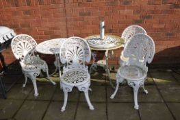 TWO CAST ALUMINIUM GARDEN TABLES AND FOUR CHAIRS, both tables 69cm in diameter along with a