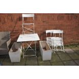 A WHITE PAINTED METAL FOLDING GARDEN TABLE AND FOUR MATCHING CHAIRS along with two plastic