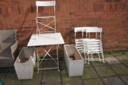 A WHITE PAINTED METAL FOLDING GARDEN TABLE AND FOUR MATCHING CHAIRS along with two plastic
