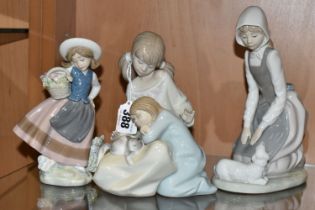 A GROUP OF THREE LLADRO AND NAO FIGURES, comprising 1534 'Little Sister', 5221 'Sweetest Scent'