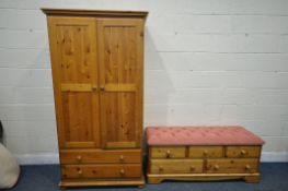 A PINE DOUBLE DOOR WARDROBE over two long drawers, width 96cm x depth 55cm x height 186cm and pine