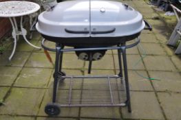 A MODERN COAL BARBECUE with dual enamel domed lids, temperature gauge, stand with undershelf width