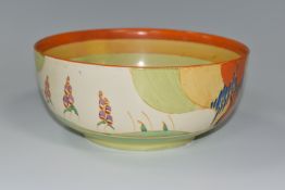 A CLARICE CLIFF 'WINDBELLS' DESIGN BOWL, with a vibrant orange, yellow, green and cream banding on