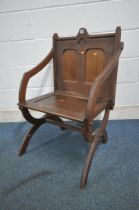 A 20TH CENTURY OAK GLASTONBURY CHAIR, backrest with quatrefoil design, shaped open armrests, on