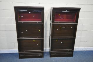 TWO MAHOGANY SECTIONAL BOOKCASES, comprising total of six sections, of two glazed hide and fall